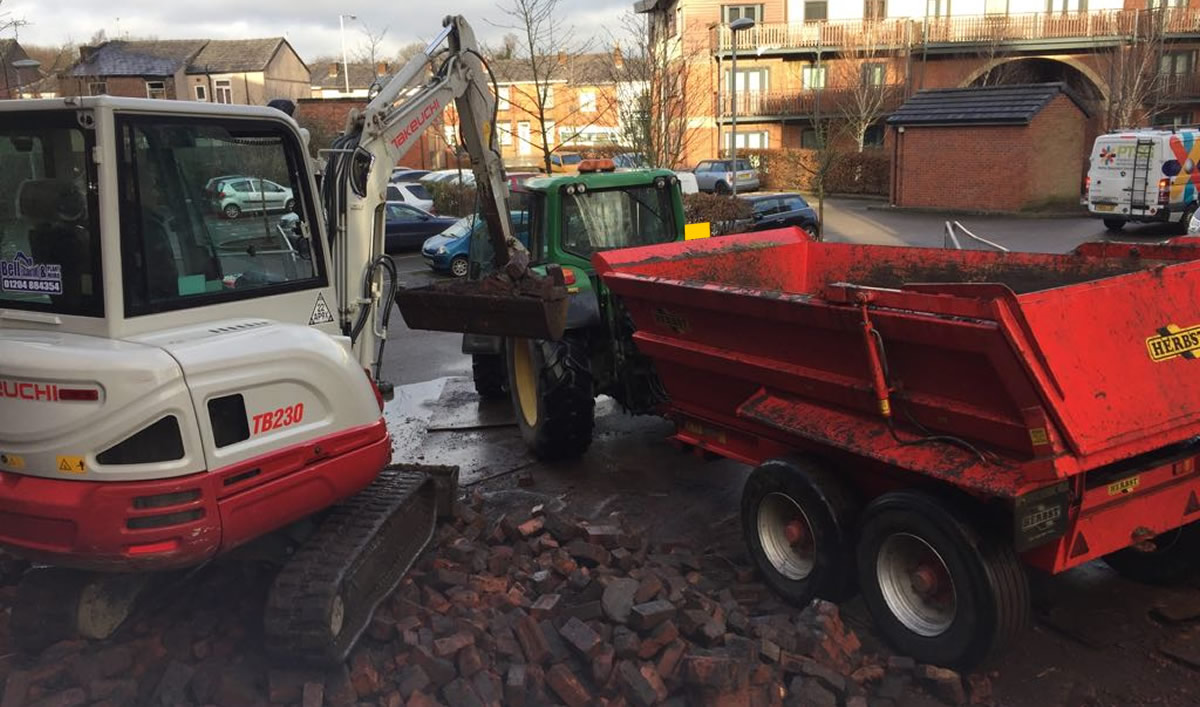 Waste removal with tractor, trailer and mini digger